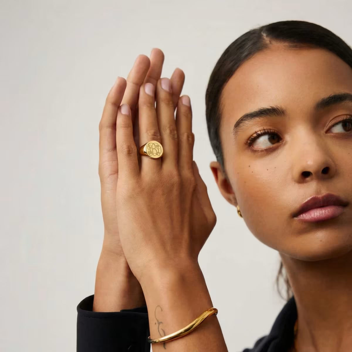 Personalised Signet Ring worn on hand showing gold finish
