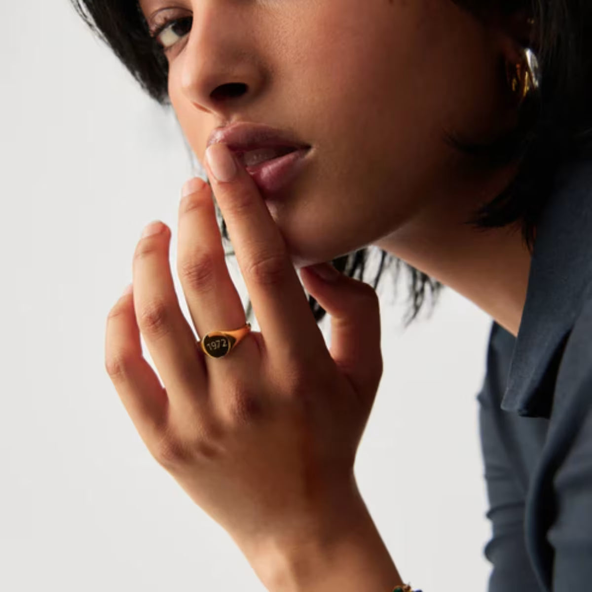 Engraved Year Signet Ring worn on hand showing gold finish