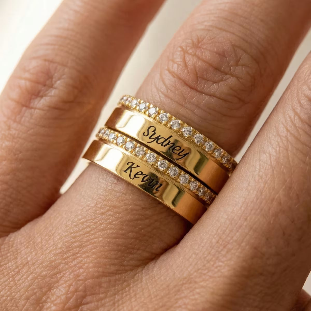 Double Band Ring stacked with other waterproof gold rings