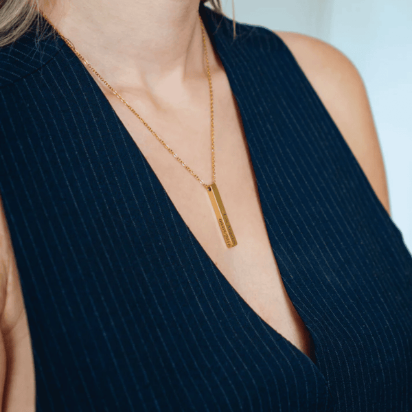 woman wearing 4 sides bar custom necklace engraved initials personalised gold jewellery UK