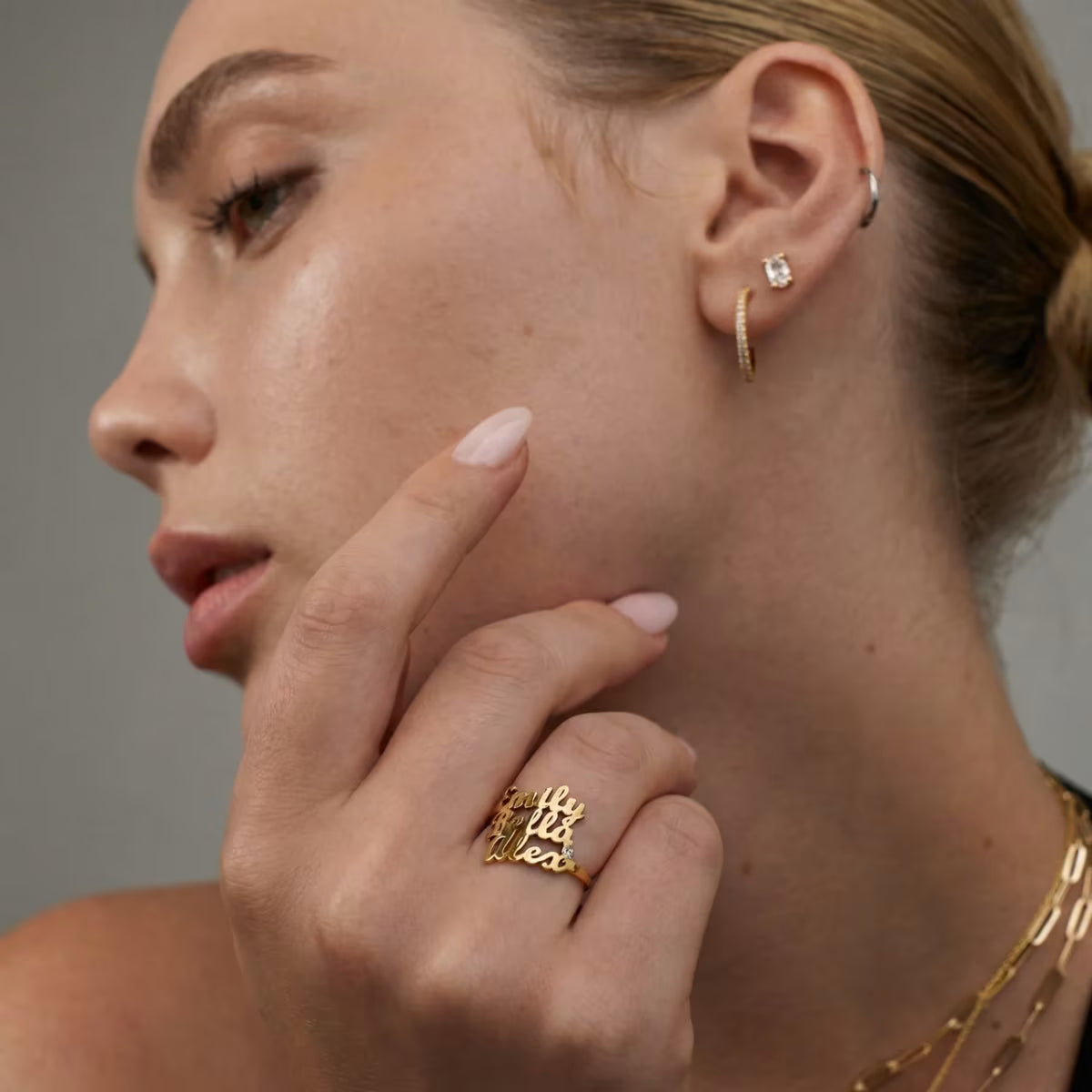 Custom Three Names Ring from above on neutral background