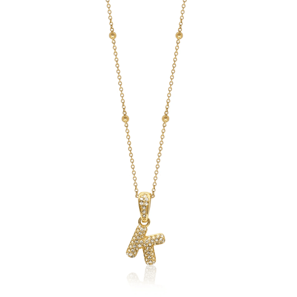 woman wearing gold bubble letter initial necklace with zirconia stones trendy personalised jewellery