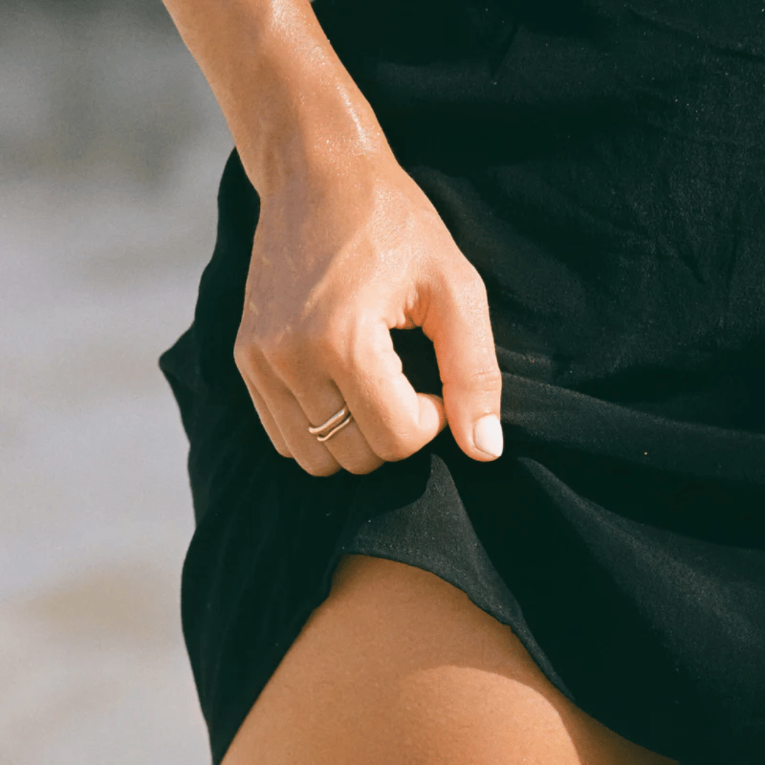 Model wearing layered Moonela zodiac rings – Gemini symbolic duality rings