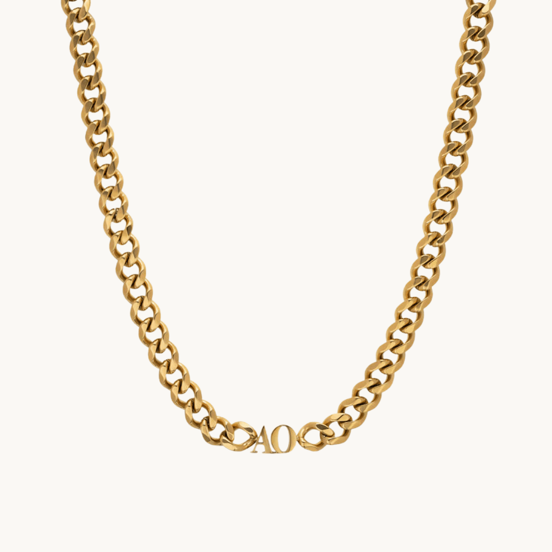 bold gold-plated curb chain necklace with custom initial pendant – flat lay