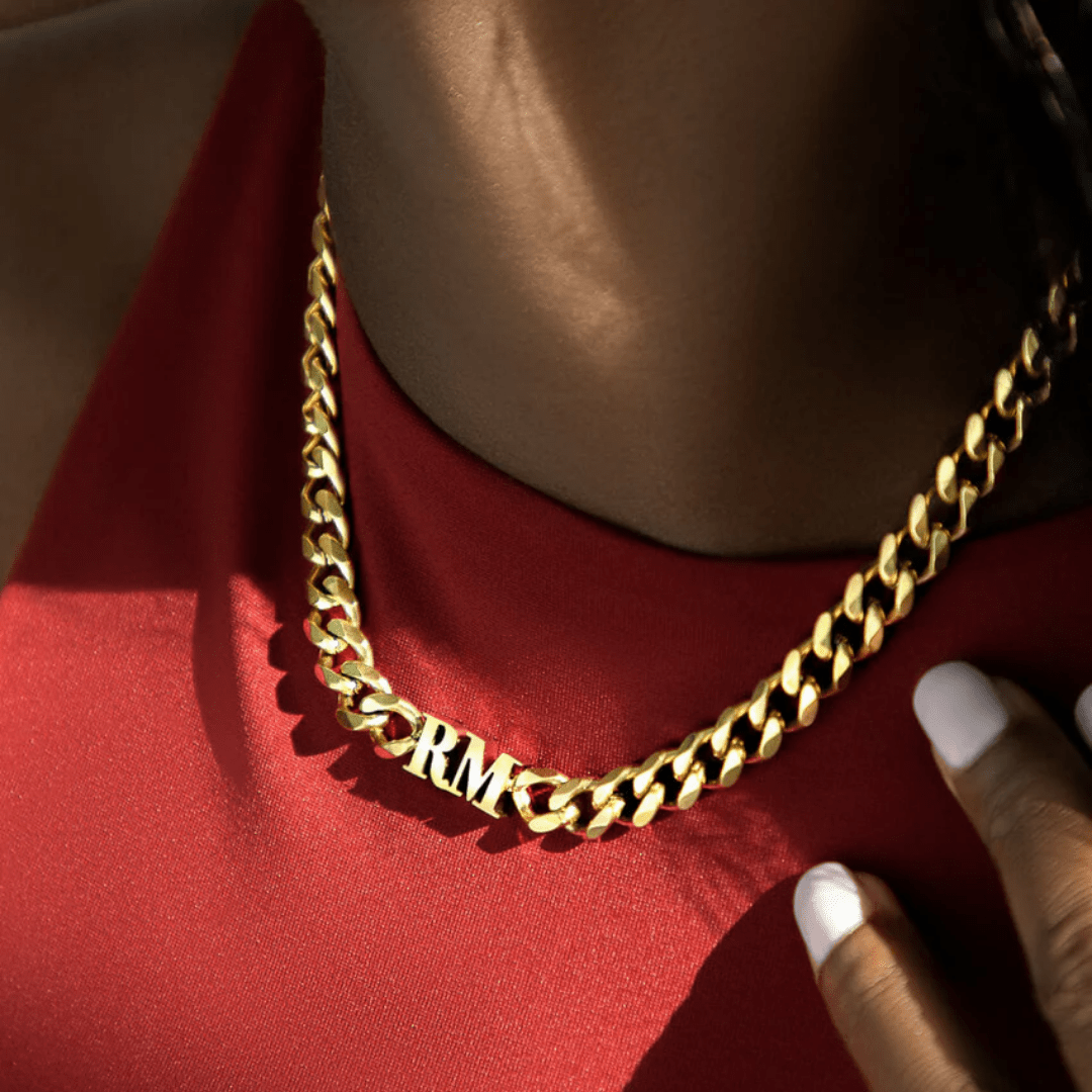 gold initial curb chain collana worn with red top, bold personalised style UK