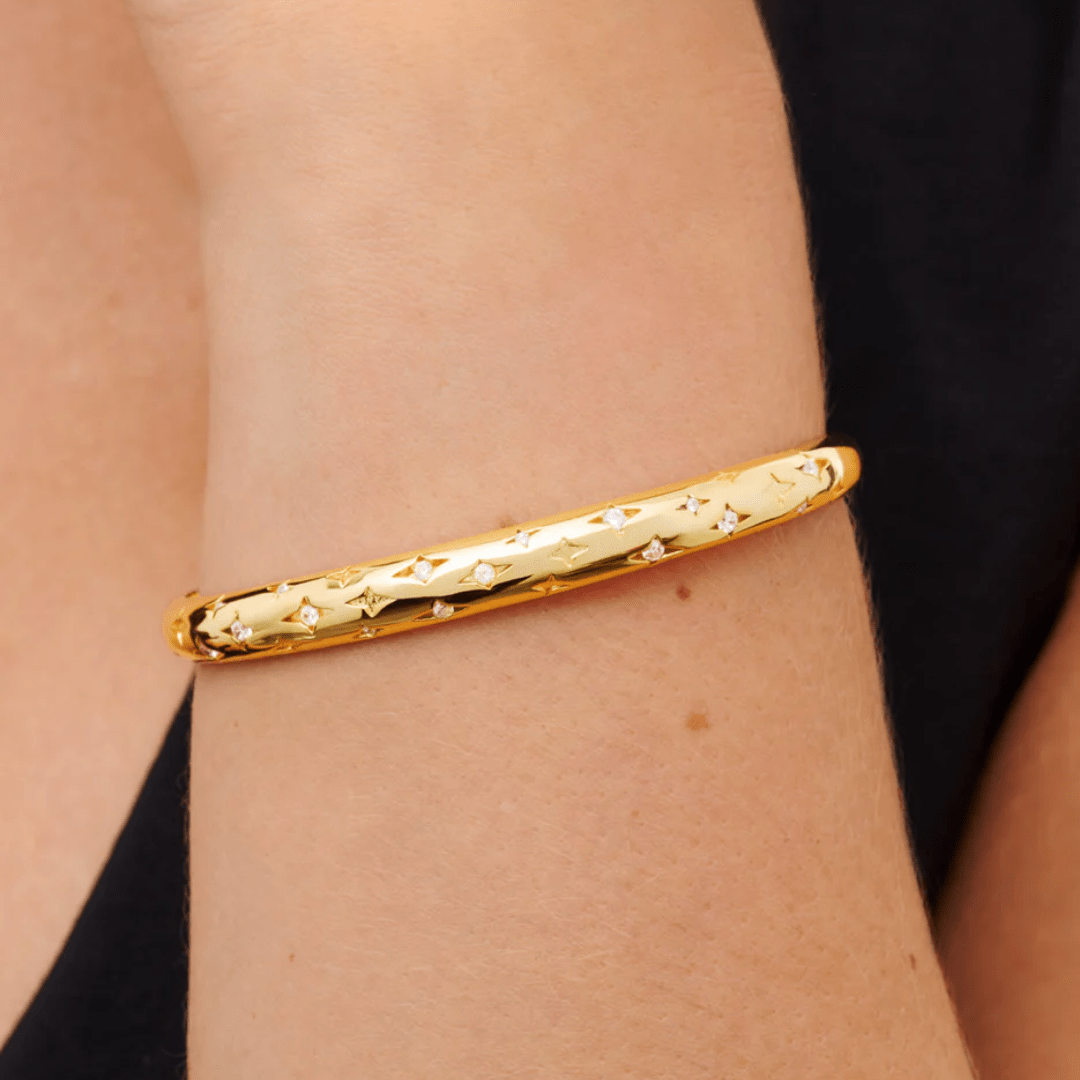 elegant gold bangle bracelet worn on wrist – minimal and celestial bracelet for women