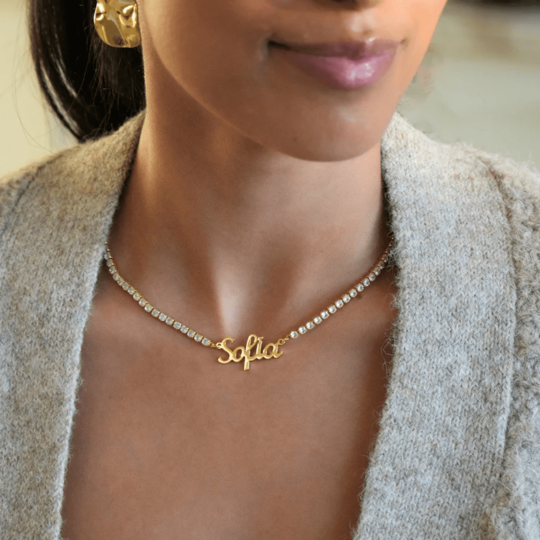 custom tennis name collana in gold with name Sofia, worn by woman, diamond look UK