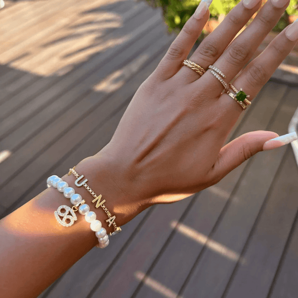 personalised birthstone bracelet with initial charm gold waterproof worn on wrist UK